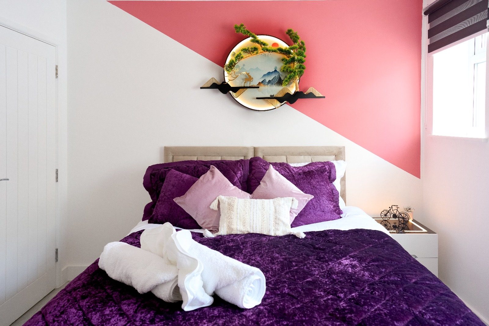 Double bed with purple velvet bedding
