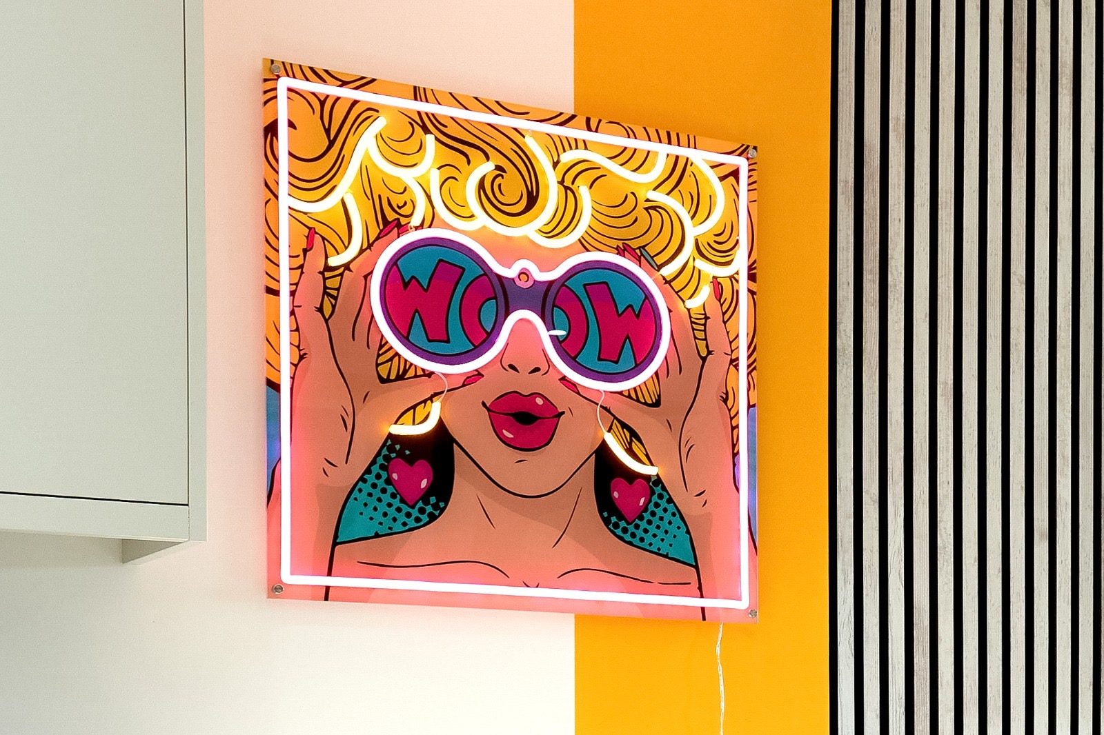 Neon pop-art sign on the kitchen wall
