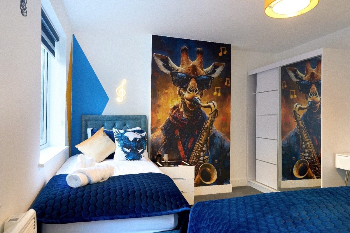 Twin beds beneath a saxophone-playing giraffe mural