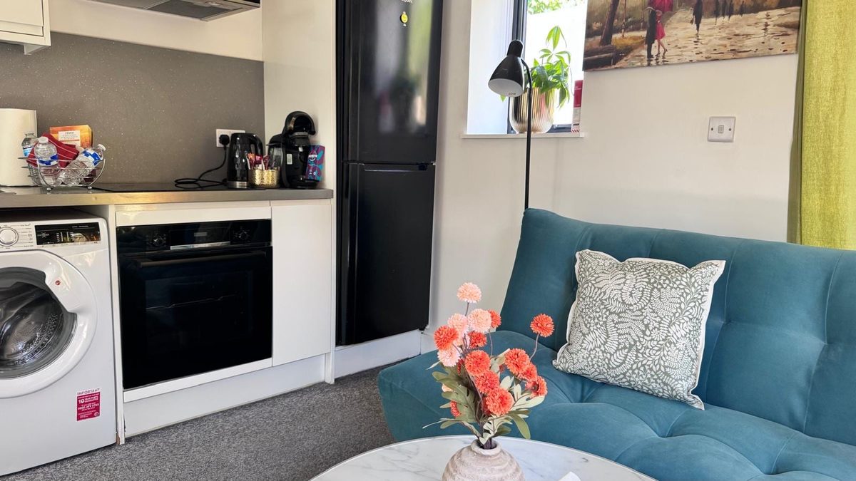 Kitchenette with an oven, washer-dryer and fridge freezer